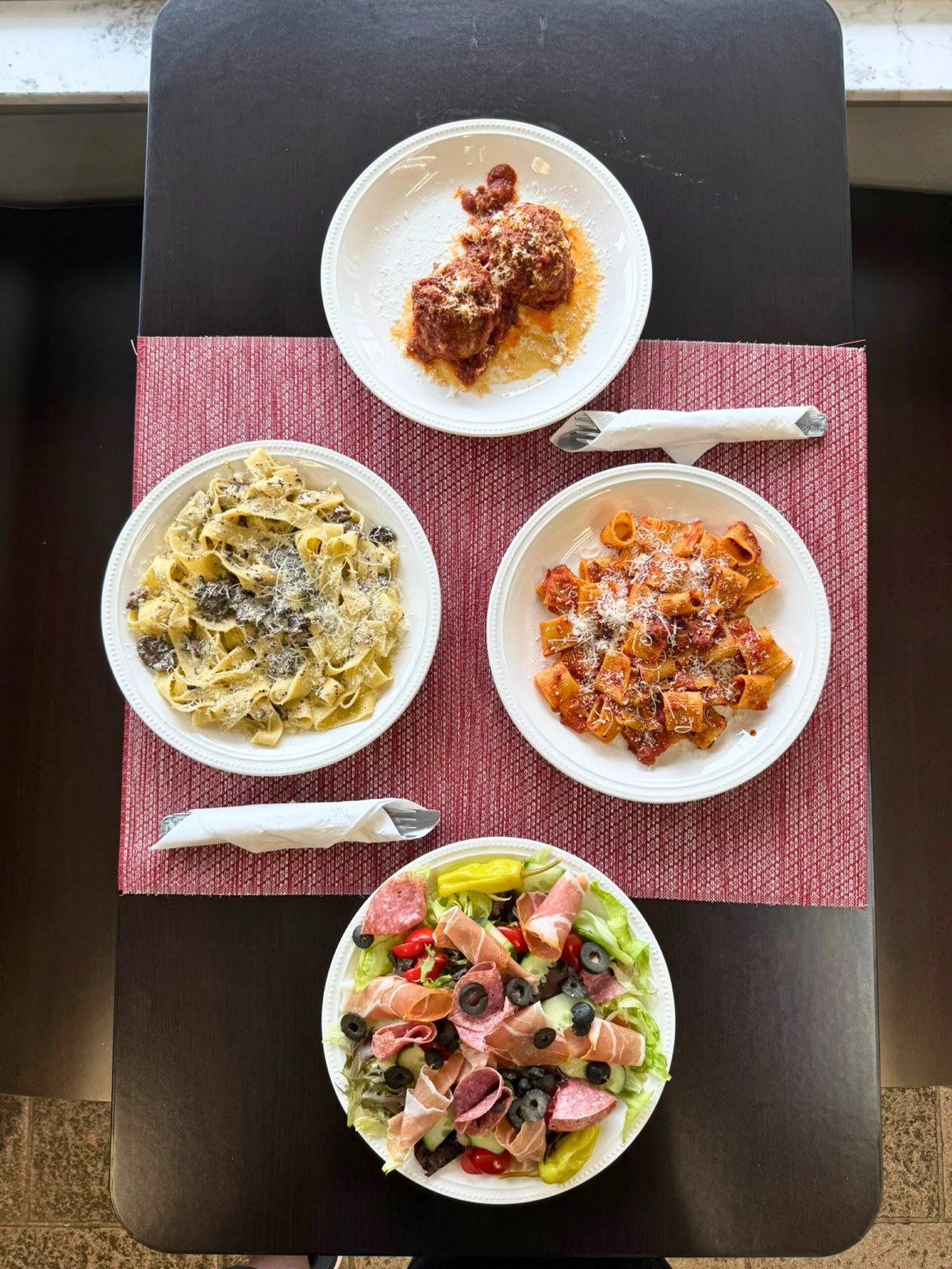 An overhead view of several Eataliana dishes