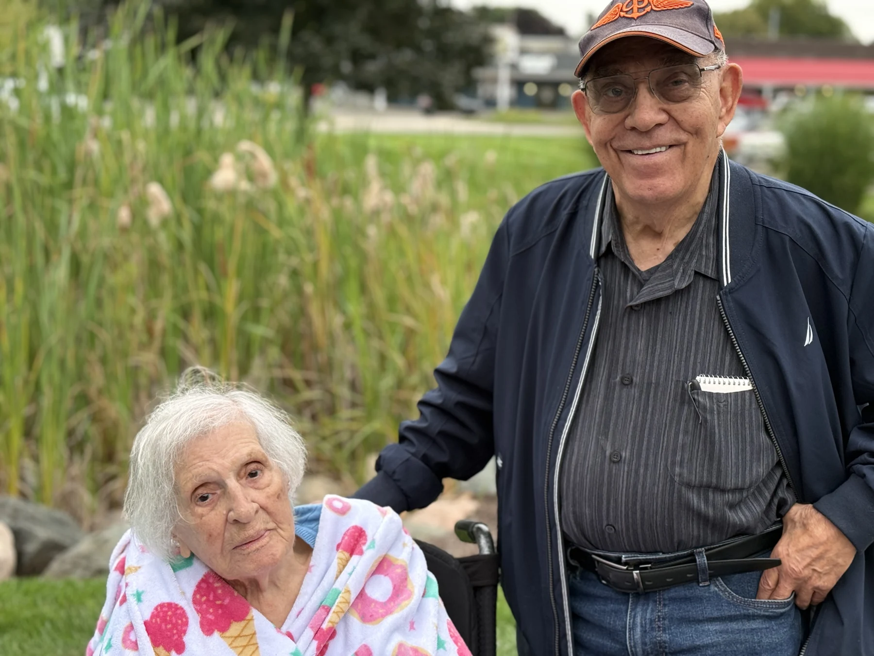Two people enjoying the Manoogian Manor community car show